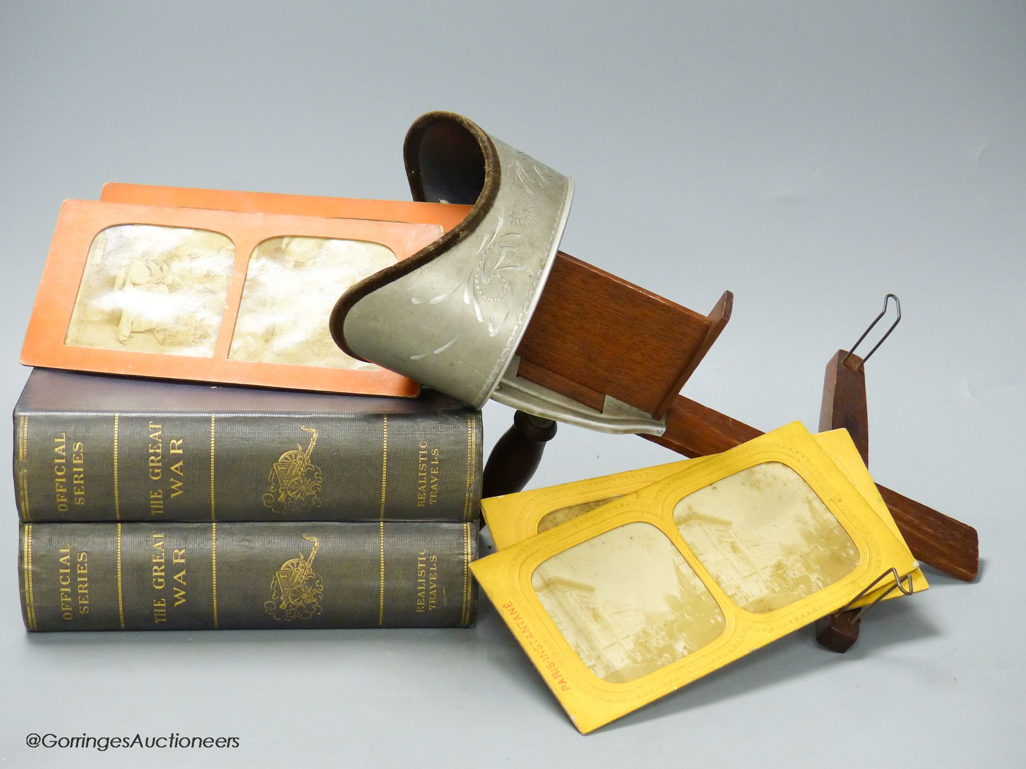 An Underwood & Underwood stereoscopic viewer, a collection of Realistic Travels 'The Great War' slides in book form case and twenty loose slides
